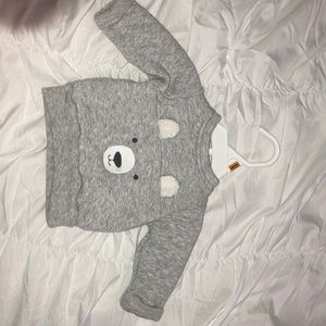 Grey and white newborn quilted bear sweater.